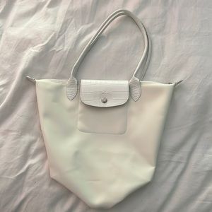 Longchamp Le Pliage bag, white with silver hardware.